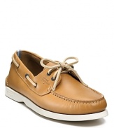 An extra-comfy boat shoe from Ferragamo WORLD, blending classic details like side laces and a gathered moc toe with accents like the chunky contrast rubber sole and 2-tone detail at the heel.