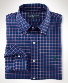 Tailored from lustrous, mercerized cotton twill in a colorful plaid print, the handsome trim-fitting sport shirt exudes timeless preppy style.