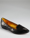 Slithering in snakeskin embossed leather, DKNY's smoking-flat inspired Salina shoes lend low-key chic.