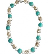 A careful arrangement of turquoise (15 mm), Mother of Pearl (14 mm) and cultured freshwater pearls (8 mm) transcend the ordinary to create a necklace of sheer depth and beauty. Set in sterling silver. Approximate length: 18 inches.