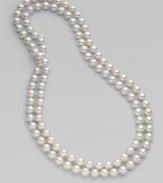 An extra long strand of round, iridescent pearls that can be worn wrapped around the neck for a classic style statement.White, organic man-made pearls Length, about 48 Made in Spain 