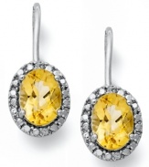 True glamour. Victoria Townsend's beautiful leverback earrings feature oval-cut citrine (2-1/2 ct. t.w.) and sparkling diamond accents. Set in sterling silver. Approximate drop: 3/4 inch.