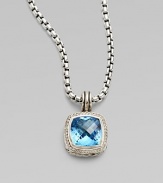 From the Albion Collection. A beautiful faceted blue topaz center stone surrounded by dazzling diamonds. Diamonds, .3 tcw Blue topaz Sterling silver Size, about ½L X ½ W Imported Please note: Chain sold separately. 