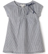 Parisian-inspired stripes and a delicate neckline bow detail add a stylish accent to a short sleeve dress from Pearls & Popcorn.