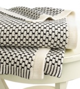 Beat the cold with this super-soft throw from Lauren by Ralph Lauren. Features a birdseye knit in cream and black hues for a cozy addition anywhere in your home.