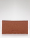 A classic bifold wallet in pebbled leather from Longchamp.