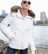 Tailored yet totally comfy, Calvin Klein's streamlined puffer jacket features appealing details like removable faux-fur trim and wide tabs near the cuffs and waist.