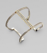 A minimal piece that dazzles with pavé white sapphires on a sterling silver cuff frame accented with 18k gold. White sapphiresSterling silver18K goldSlip-on styleDiameter, about 2¼Imported 