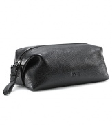 This is part of a new BOSS basics program that is exclusive to Bloomingdale's for only a limited time. Pebbled leather dopp kit with top zip closure. Pull tab on zipper. Internally lined.