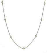 Inch by inch of luminous sparkle. B. Brilliant's delicate necklace features nine round-cut cubic zirconia stations (9/10 ct. t.w.) set in 18k gold over sterling silver. Approximate length: 20 inches.