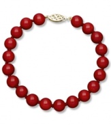 Crimson chic. This stunning strand bracelet features bold red agate (80 ct. t.w.) in a polished 14k gold setting. Approximate drop: 7-1/2 inches. Approximate bead diameter: 8 mm.