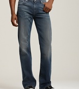 These classic 7 for All Mankind bootcut jeans in a faded wash fit low on the waist, slim through the thigh, then widen into a bootcut opening. The back pockets features the signature squiggle.