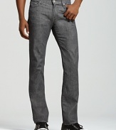 These straight leg 7 for All Mankind jeans sit low on the waist with a slim fit through hip and thigh and a slight tapering at the ankle. Icy gray wash with back pocket signature squiggle detail.