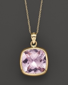 A bold, faceted amethyst glitters in a 14K yellow gold setting.