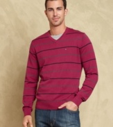 Heat up your cool-weather look with this sharp striped sweater from Tommy Hilfiger.