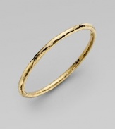 From the Martellato Collection. A luminous accent for the wrist is designed with the unique hammered look of 18k yellow gold. Chic to wear alone or doubled up with others. 18k yellow gold Diameter, about 3 Made in Italy 