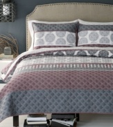 Circle up! Give your space a modern makeover with this Trevi quilt from Bryan Keith, featuring a fabulous quilted circle design for luxe texture and a contemporary palette of red and gray.