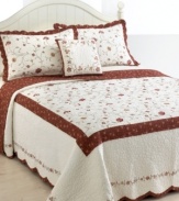 Whimsical florals in delicate embroidery cascade across crisp cotton quilting in this Silkroad sham. The reverse presents a rich pattern of taupe florals over burgundy ground, offering a warm color accent.