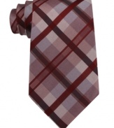 Pave your way to polished style with this grid-patterned silk tie from Calvin Klein.