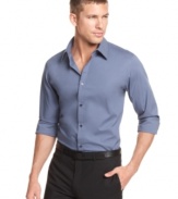 Keep it smooth. With an easy stretch fabrication, this Calvin Klein shirt is the perfect way to top off your favorite pair of dress pants.