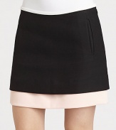 A contrasting layer peeks out from underneath this ultra-short, woven mini skirt.Side zipperSlash pocketsLayered-look hemAbout 15 from natural waistCottonDry cleanImportedModel shown is 5'10 (177cm) wearing US size 4. 