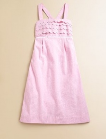 Crafted in preppy seersucker, this classic A-line frock is ultra-glam with scalloped detail, lace trim and smocked back.SquareneckAdjustable straps cross at backScalloped bodicePleated empire waistCottonMachine washImported