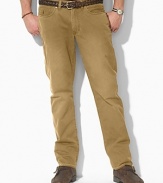 Casual pants tailored from sun-faded mid-weight chino, designed for authentic five-pocket styling and a straight leg. Standard-rise belted waist with Ralph Lauren's signature shank closure. Five-pocket jean styling with signature metal rivets. Flat-front with a timeworn, vintage feel.