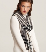 Burberry ups the glam factor with their soft check scarf in crinkled fabric with fringe trim. Let the signature pattern and luxurious proportions transform your look.