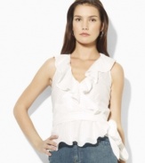 Designed in a flattering wrap silhouette from slightly sheer cotton voile, the sleeveless blouse exudes vintage charm with an elegant striped pattern and soft ruffles, from Lauren Jeans Co.