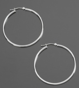 These delicate hoop earrings are the perfect compliment to your dressed-up style or everyday look. Crafted in 14k white gold. Approximate diameter: 3/8 inch.