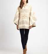 Inspired by Midwestern textiles, this slouchy poncho style will keep you cozy all season long.HoodDropped shouldersOpen sleevesConcealed button frontAbout 30 from shoulder to hem82% wool/18% cottonDry cleanMade in USAPlease note: one size fits all.This style runs true to size. We recommend ordering your usual size for a standard fit. 