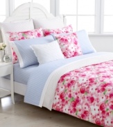 Reminiscent of a quaint backyard garden, Tommy Hilfiger's Rose Cottage duvet cover set features an allover watercolor rose print in a bright pink colorway with pops of green for a picturesque look.