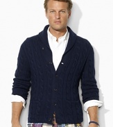 Cable-knit from plush cotton and cashmere yarns for lightweight warmth, this classic buttoned cardigan is handsomely updated with a shawl collar for sleek style.