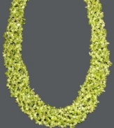 Add a layer of earthy green hues to your neckline. This vivid necklace features layers of peridot gemstone chips (4-6 mm) and a 14k gold toggle clasp. Approximate length: 20 inches.