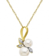 A natural choice. This pendant, crafted from 10k gold, exudes elegance with cultured freshwater pearls (5-6 mm) and diamond accents along a whimsical leaf motif. Approximate length: 18 inches. Approximate drop length: 3/4 inch. Approximate drop width: 1/3 inch.