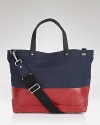 This durable, downtown tote is perfect for everyday use with its modern color block design and reinforced material.