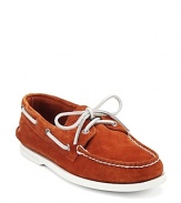 In a supple suede and sunny orange hue, these Sperry boat shoes are a luxe update of an American classic.