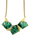 Space chic is tres chic. Express abstract sentiment with the asymmetrical shapes and chunky design on RACHEL Rachel Roy's funky geometric necklace. Crafted in gold tone mixed metal with ombre shell-colored resin stones. Approximate length: 18 inches. Approximate drop length: 3-3/4 inches. Approximate drop width: 3-3/4 inches.