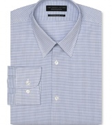 Dress shirt with spread collar, two button barrel cuffs and a slimmer fit through the body, with a blue grid pattern.