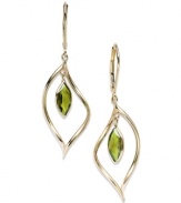 Take your look to the next level with the right amount of color. Marquise-cut peridot (1-3/4 ct. t.w.) adds the sparkle to these shining 14k gold earrings. Approximate drop: 1-3/4 inches.