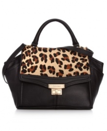 Add some animal attraction to your everyday accessorizing with this leopard print design from Calvin Klein. Gorgeous leather is accented with soft hair calf and signature hardware, and it's perfectly sized for stashing wallet, phone, makeup case, and more.