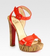 Sky-high heel and platform in an abstract print, finished with vibrant patent leather straps and a signature red leather sole. Self-covered heel, 5½ (140mm)Covered platform, 1 (25mm)Compares to a 4½ heel (115mm)Patent leather upperLeather liningSignature red leather solePadded insoleMade in Italy