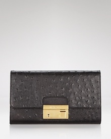 Michael Kors' convertible clutch brings the versatility after dark. Dual purpose, this ostrich-embossed bag is equally chic over the shoulder or tucked under a well-dressed arm.