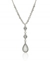 Accentuate your neckline with this daring pendant from Monet. Crafted in silvertone mixed metal, pendant is composed of circular, crystal-accented medallions leading to a radiant pear-shaped crystal. Approximate length: 16 inches + 2-inch extender. Approximate drop: 2-1/4 inches.