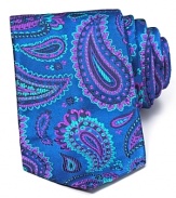 A bold paisley print in vivid hues adorns this DUCHAMP silk tie.