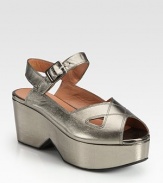 French metallic leather silhouette with a slight cutout wedge and an adjustable ankle strap. Self-covered wedge, 3 (75mm)Island platform, 1½ heel (40mm)Compares to a 1½ heel (40mm)Metallic leather upperLeather liningRubber solePadded insoleMade in Francebr>OUR FIT MODEL RECOMMENDS ordering true size. 