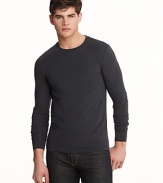 Long sleeve crewneck with wide cuff bands. Slimmer fitting with logo embroidered at bottom hem.