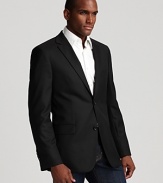 Dress it up or down. Two button sport coat with side vents. Slightly textured fabric, two front flap pockets.