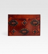 Modern, masculine design crafted in Italian leather with applique patch detail.Two card slotsPatent Leather4W x 3HMade in Italy