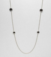 Faceted black onyx stones set in sleek sterling silver on a long link chain. Black onyxSterling silverLength, about 38Lobster clasp closureImported 